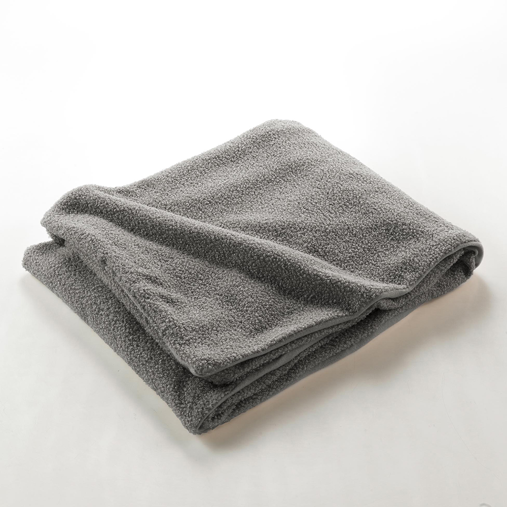 curly-woolly-throw-over-grey-180cm-x-220cm